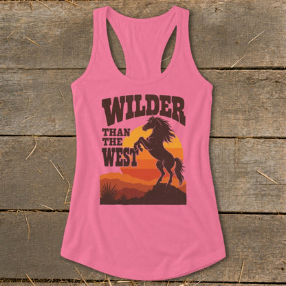Pink tank top with "Wilder Than The West" text and a horse at sunset graphic.