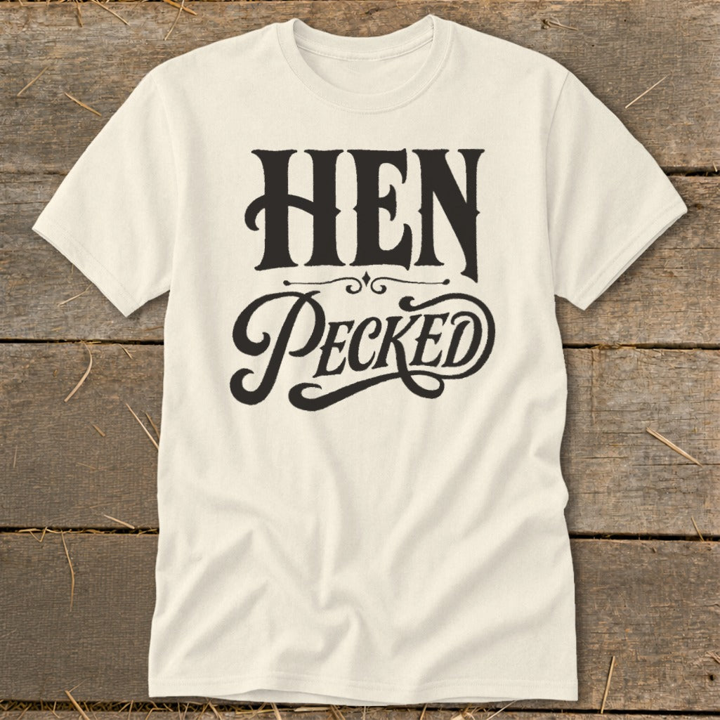 Cream t-shirt with "HEN PECKED" text in black gothic lettering.