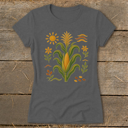 T-shirt with a stylized corn stalk, sun, flowers, and leaves design.