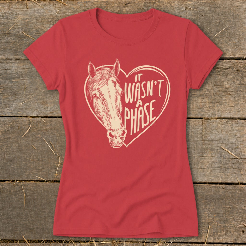 Red t-shirt with a horse head inside a heart and text "IT WASN'T A PHASE".