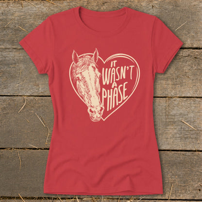 Red t-shirt with a horse head inside a heart and text "IT WASN'T A PHASE".