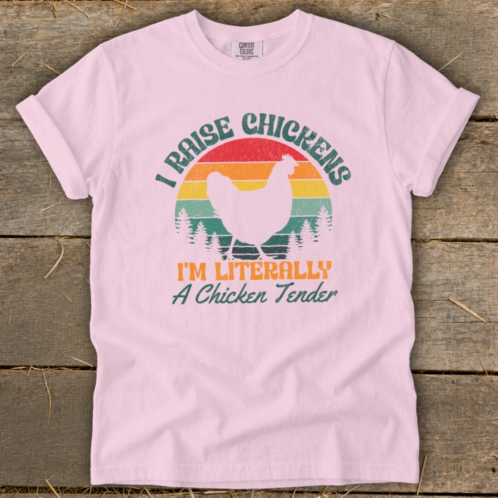 Pink t-shirt with "I Raise Chickens, I'm Literally A Chicken Tender" text and chicken graphic.
