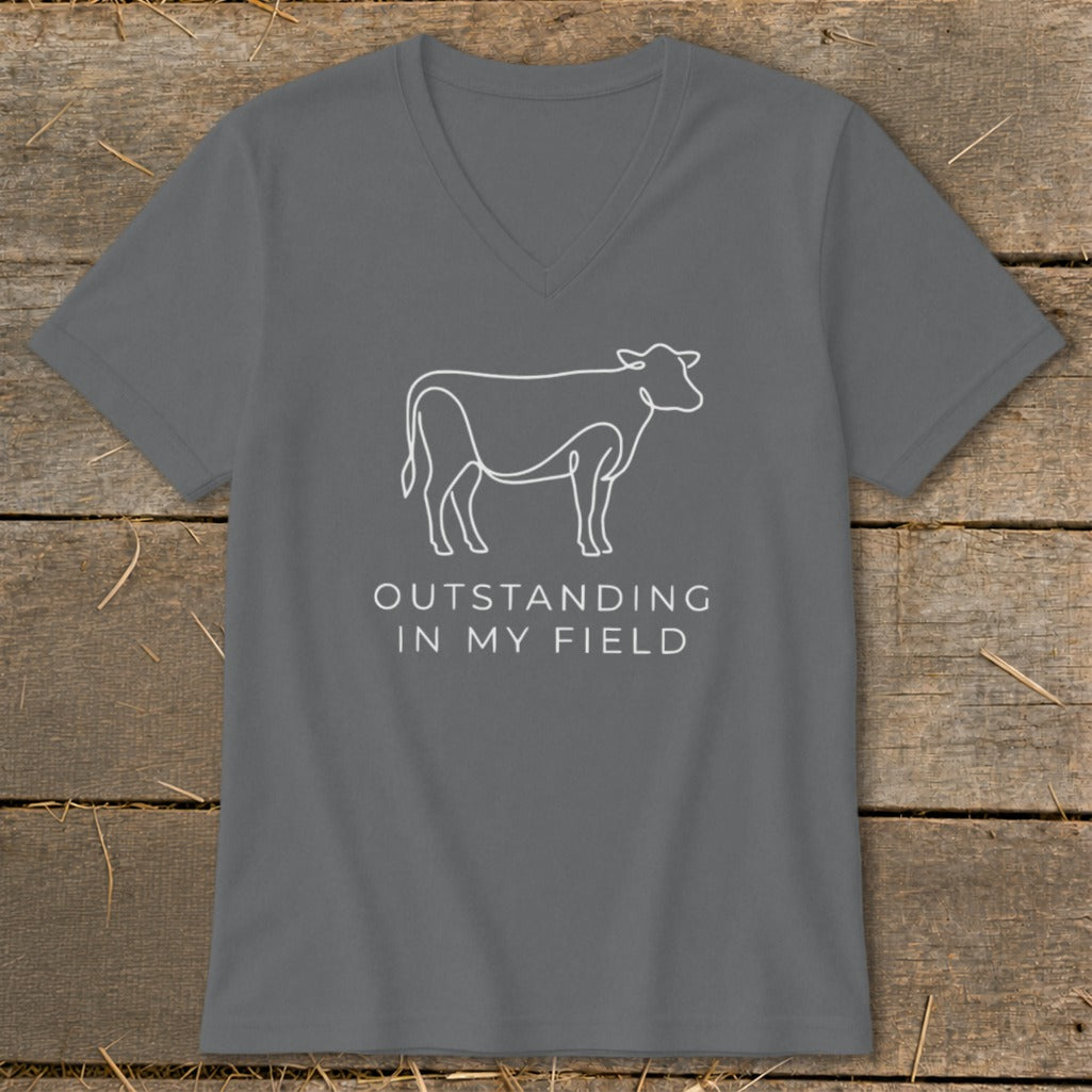 Gray v-neck t-shirt with white line drawing of a cow and text "OUTSTANDING IN MY FIELD".