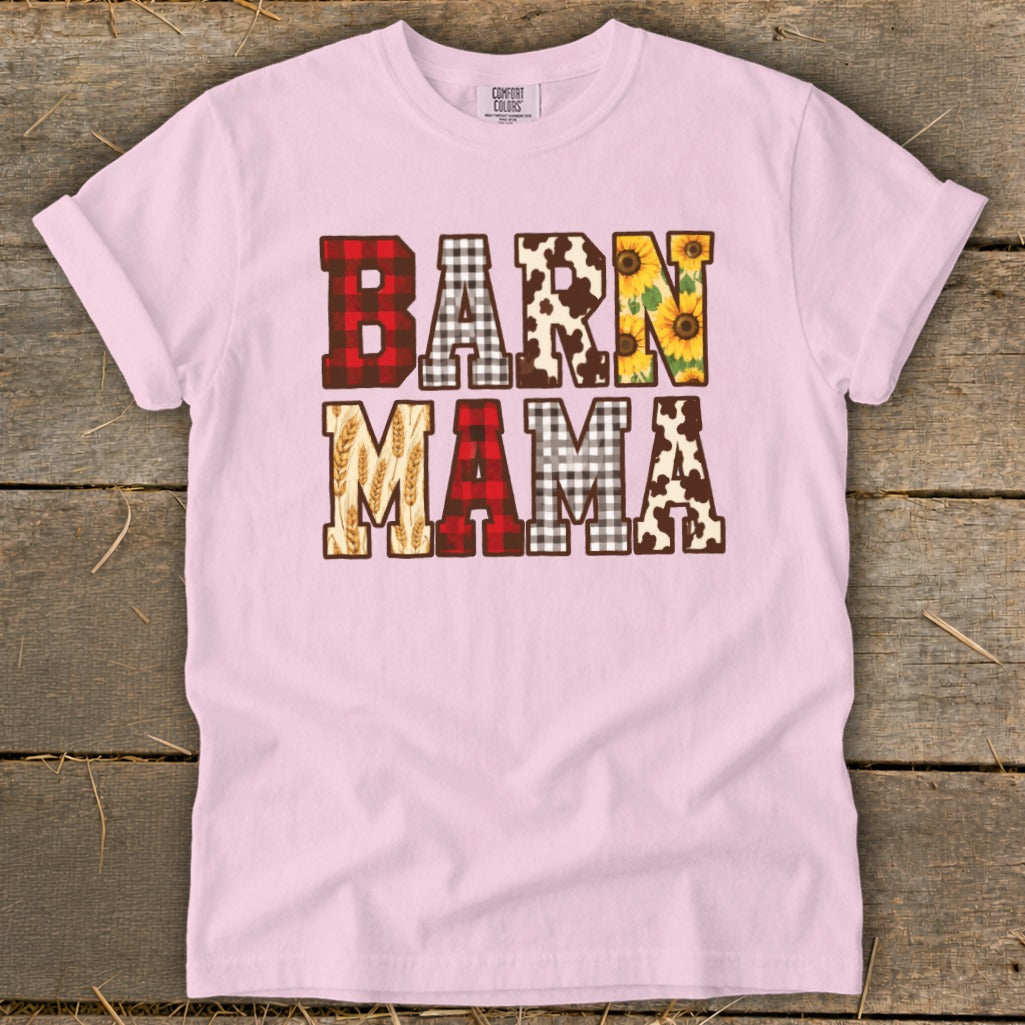 Pink t-shirt with "BARN MAMA" text featuring plaid, cow print, sunflowers, and wheat.