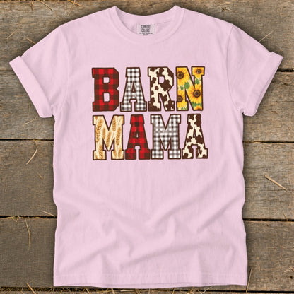 Pink t-shirt with "BARN MAMA" text featuring plaid, cow print, sunflowers, and wheat.