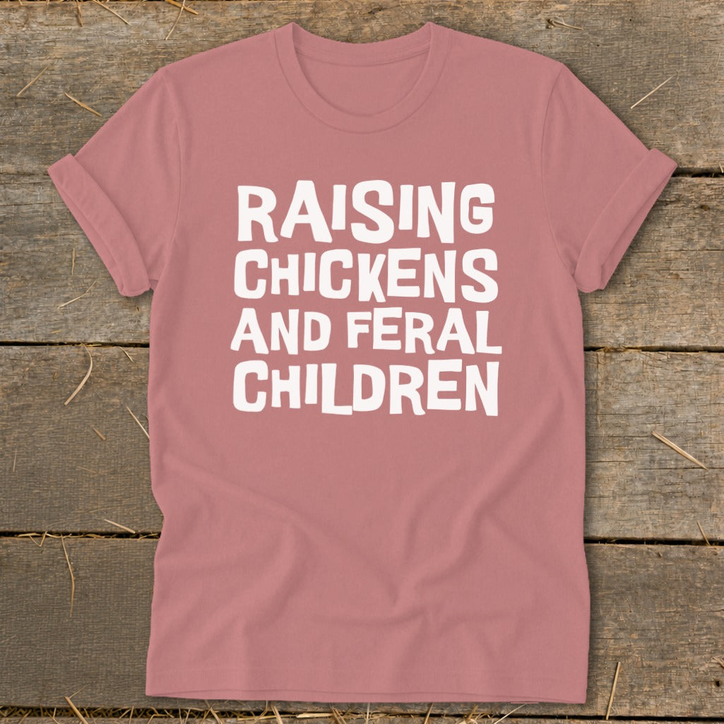Rose t-shirt with white text "RAISING CHICKENS AND FERAL CHILDREN".