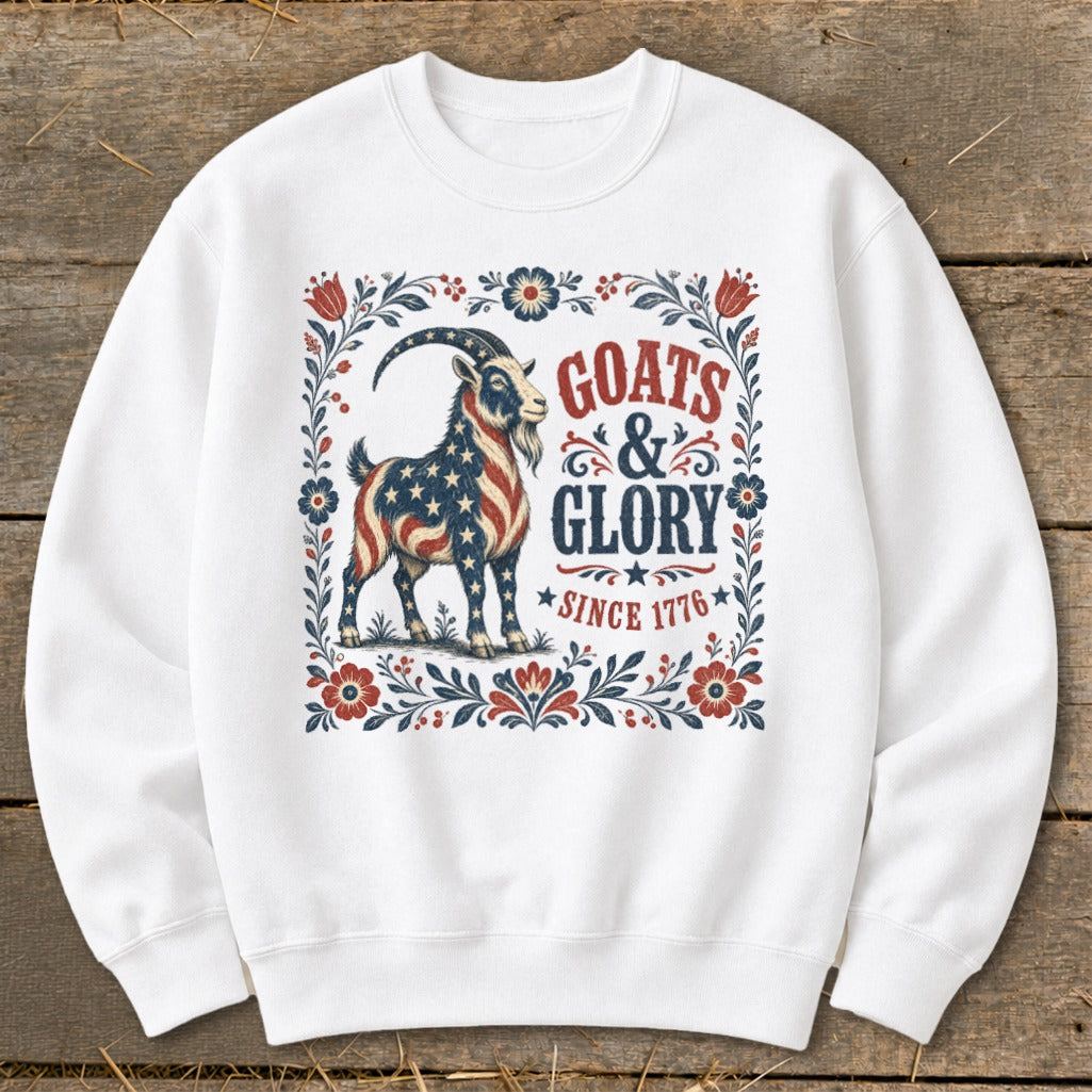 White sweatshirt with a goat in American flag colors and text "Goats & Glory Since 1776".