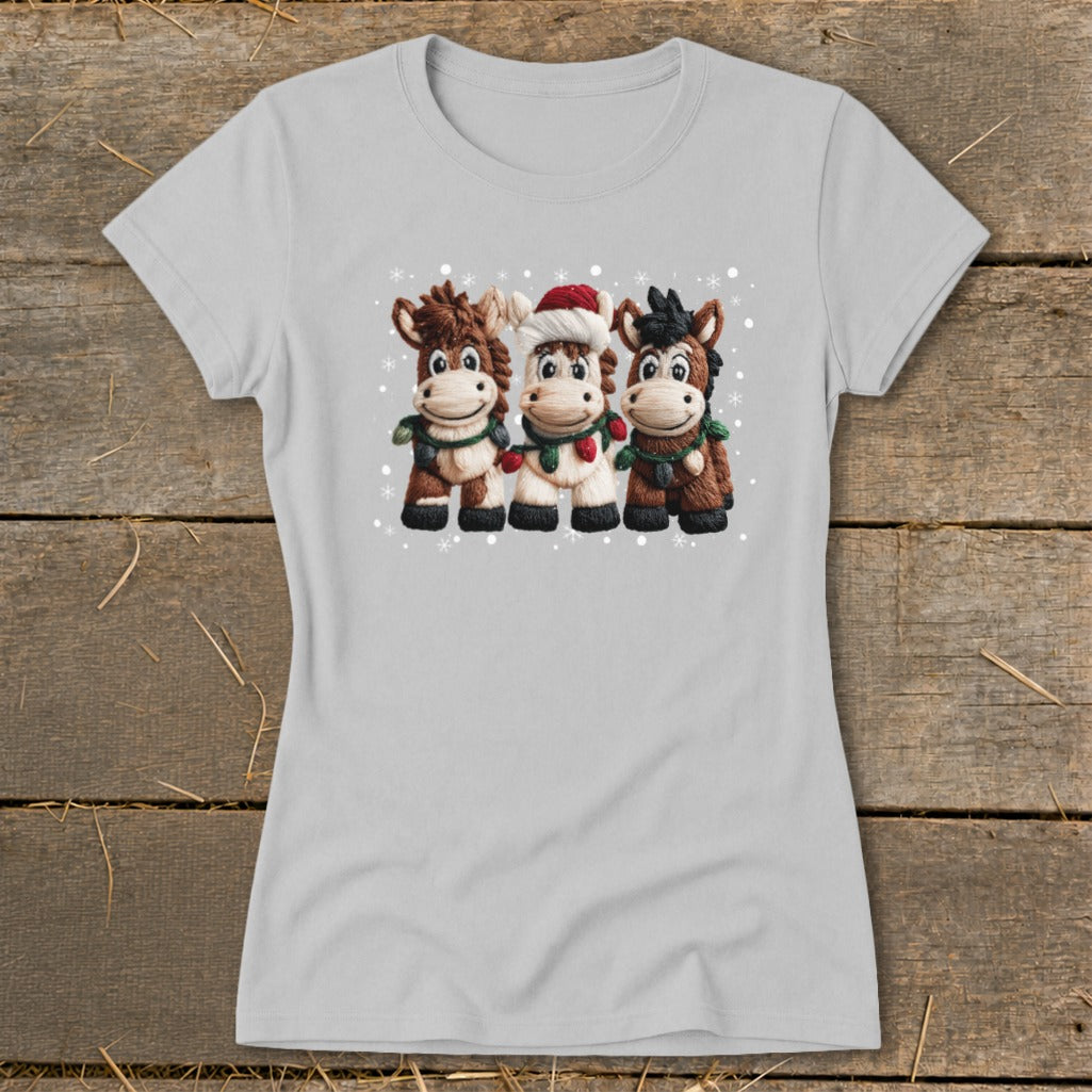 Light gray t-shirt with three cartoon horses wearing Christmas decorations.