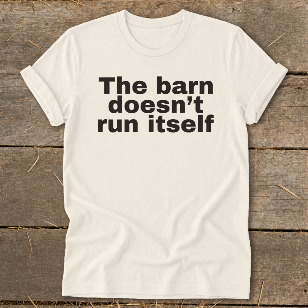 Cream t-shirt with black text that reads "The barn doesn't run itself".