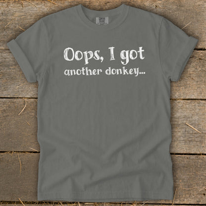 Gray t-shirt with white text that reads "Oops, I got another donkey..."