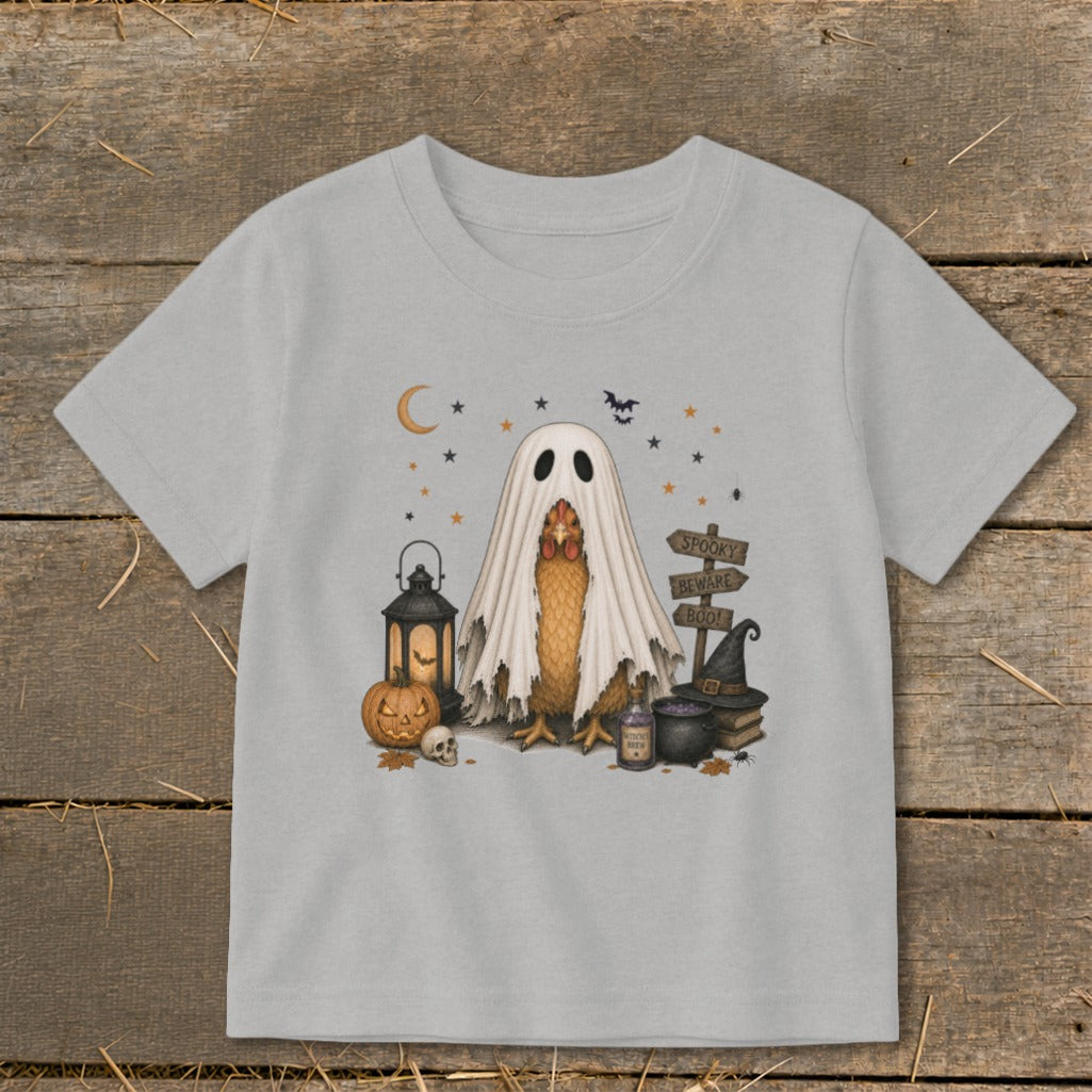 Chicken wearing a ghost costume with Halloween decorations and spooky signs.