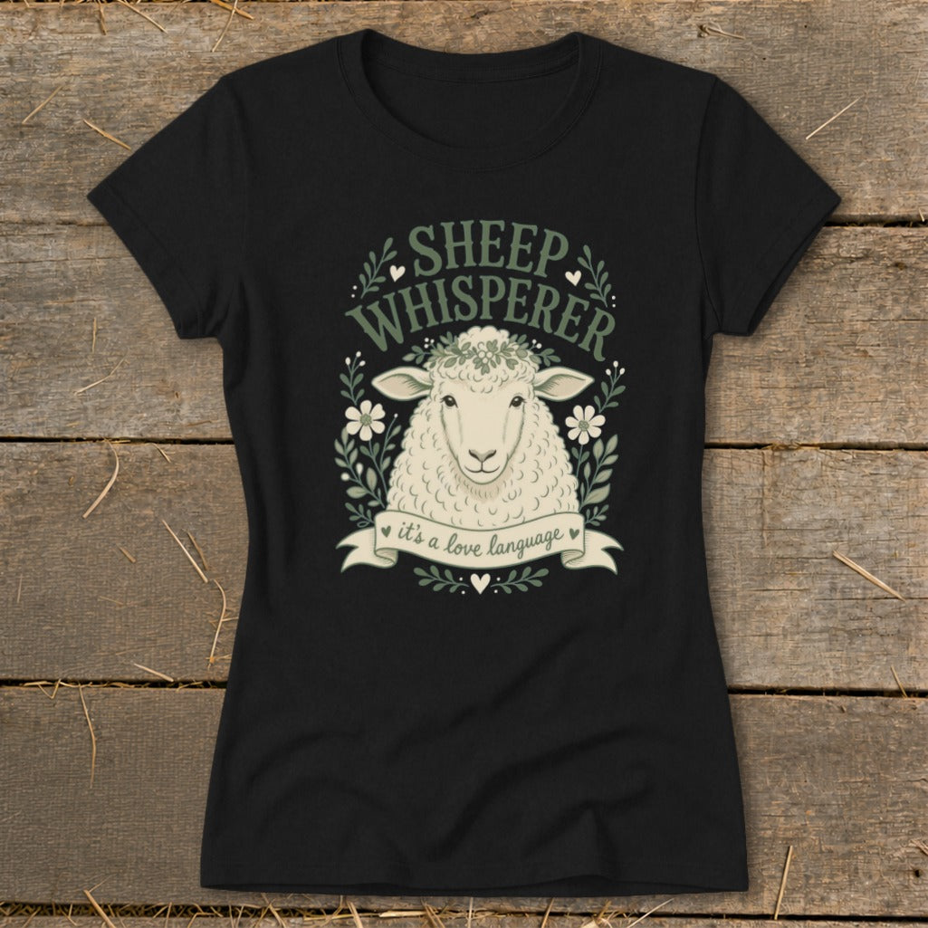 Black t-shirt with a sheep illustration and text "SHEEP WHISPERER it's a love language".