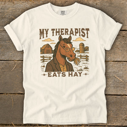 T-shirt with horse wearing glasses and suit, "My Therapist Eats Hay" text.