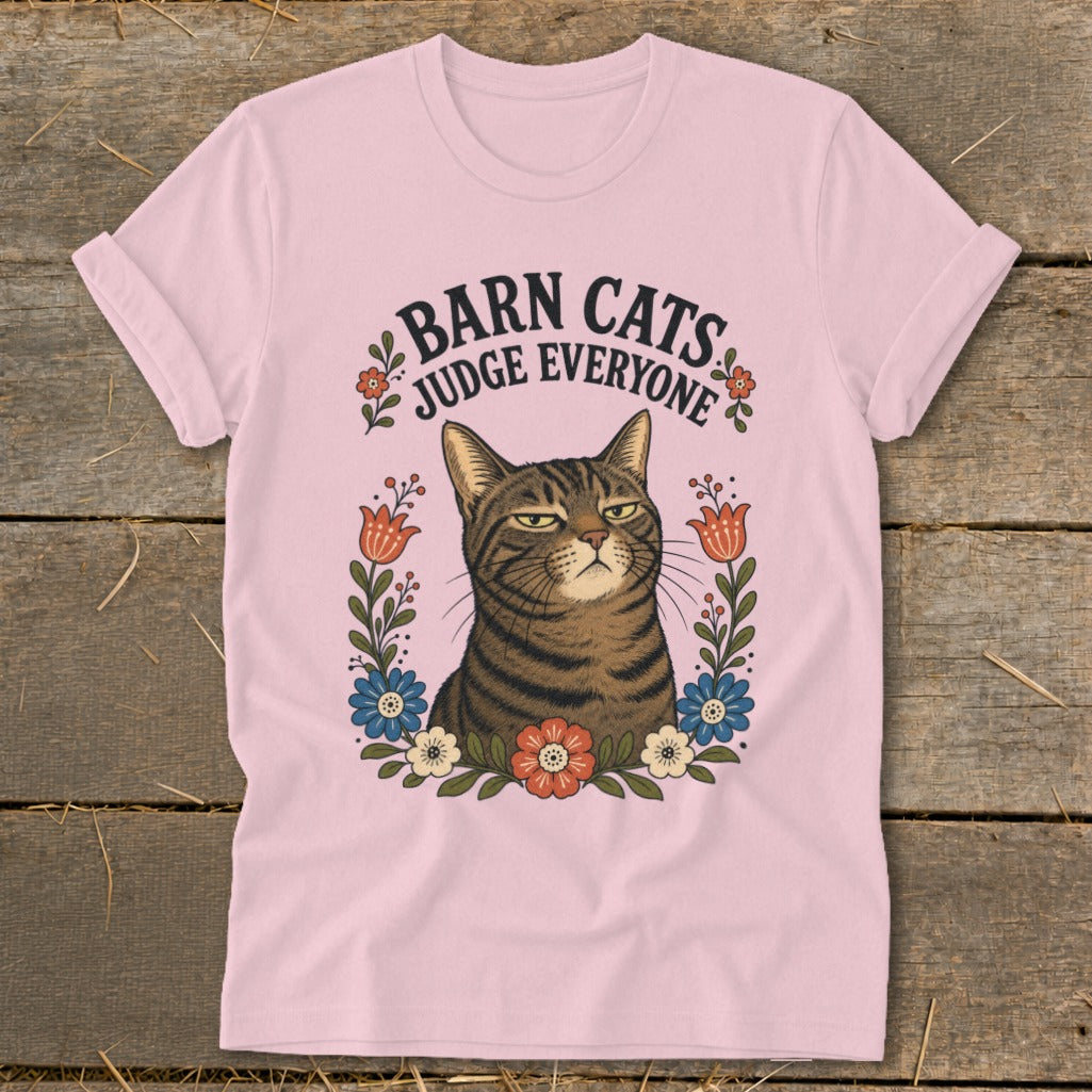 Pink t-shirt with a tabby cat illustration and text "Barn Cats Judge Everyone."