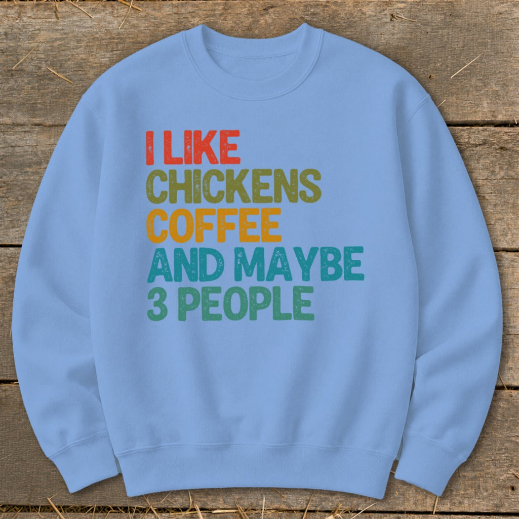 Light blue sweatshirt with text "I LIKE CHICKENS COFFEE AND MAYBE 3 PEOPLE".