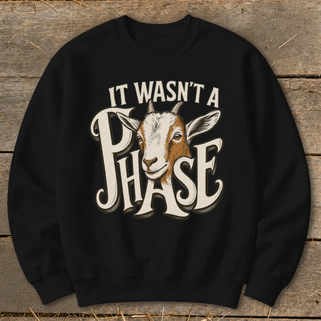 Black sweatshirt with goat graphic and text "It Wasn't a Phase".