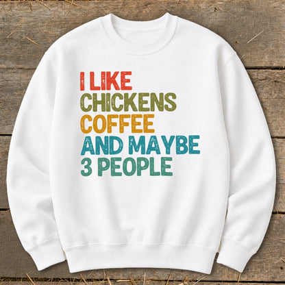White sweatshirt with text "I like chickens, coffee and maybe 3 people".