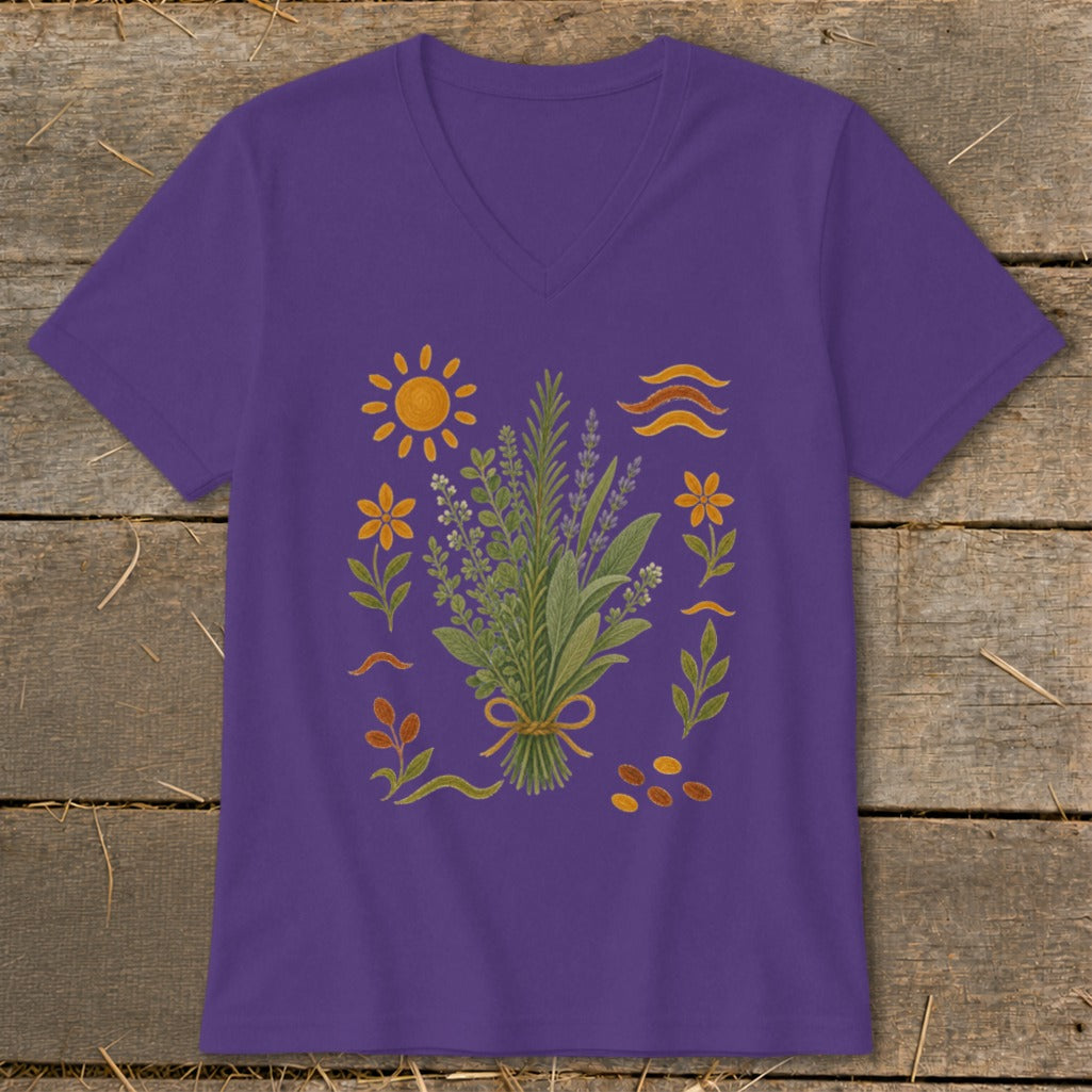 Purple t-shirt with a bouquet of herbs, sun, flowers, and abstract shapes.