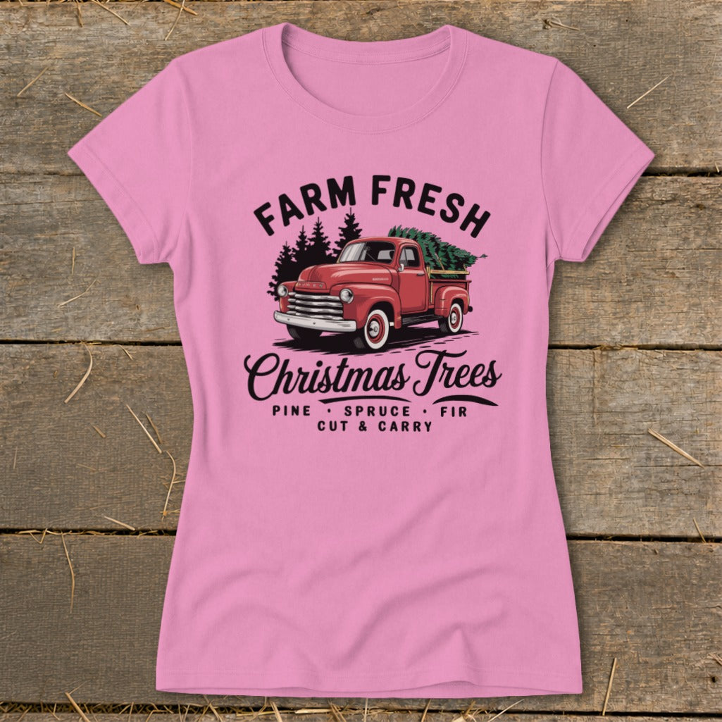Pink t-shirt with "Farm Fresh Christmas Trees" text and red truck with tree.