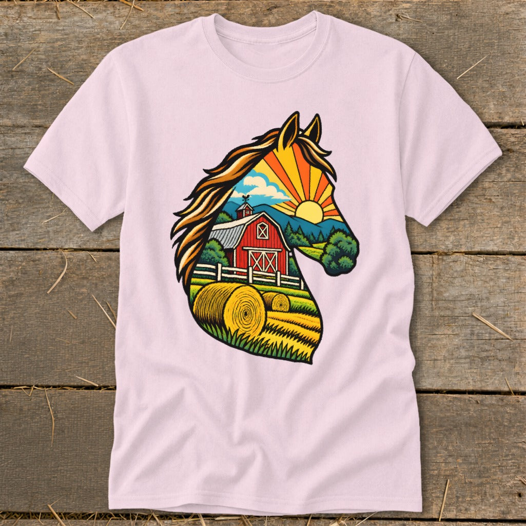 A light pink t-shirt features a horse head graphic filled with a vibrant countryside scene.