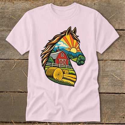 A light pink t-shirt features a horse head graphic filled with a vibrant countryside scene.