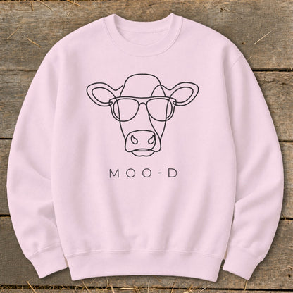 Pink crewneck sweatshirt with a minimalist cow wearing sunglasses and the text "MOO-D".