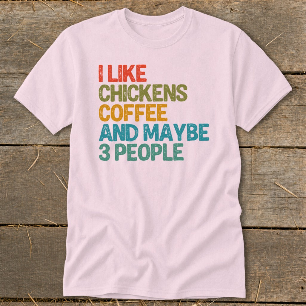 Pink t-shirt with text "I like chickens coffee and maybe 3 people".