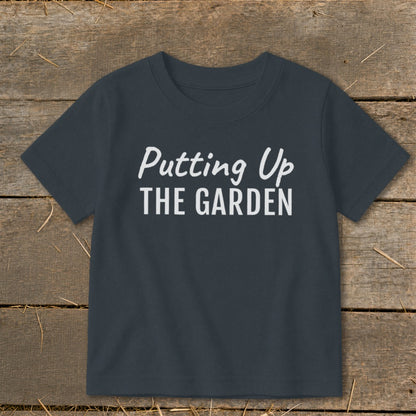 Dark grey t-shirt with white text "Putting Up THE GARDEN".
