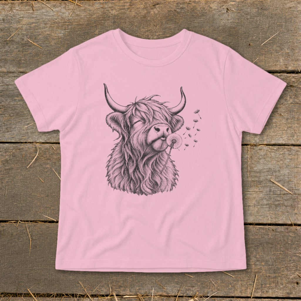 Pink t-shirt with sketch of a Highland cow blowing on a dandelion.