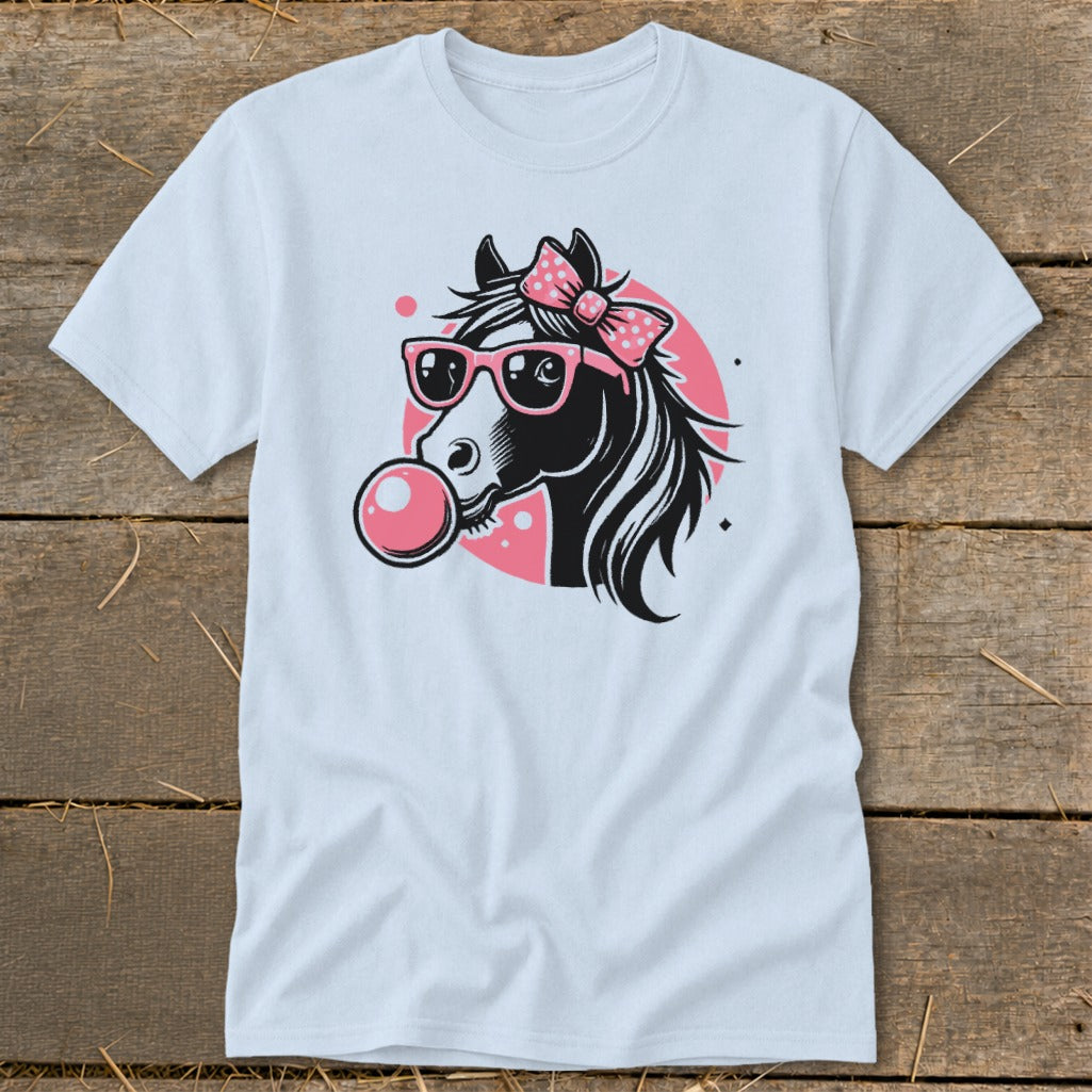 Black and white horse with pink bow and sunglasses blowing bubblegum.