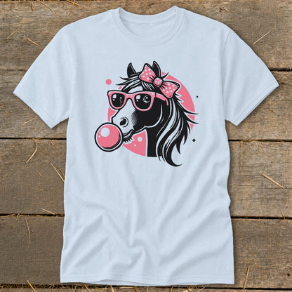 Black and white horse with pink bow and sunglasses blowing bubblegum.