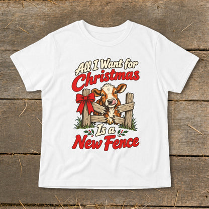 White t-shirt with a cow peeking over a fence, text says "All I Want for Christmas Is a New Fence".