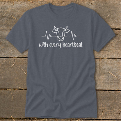 Dark gray t-shirt with white cow and heartbeat graphic, text "with every heartbeat".