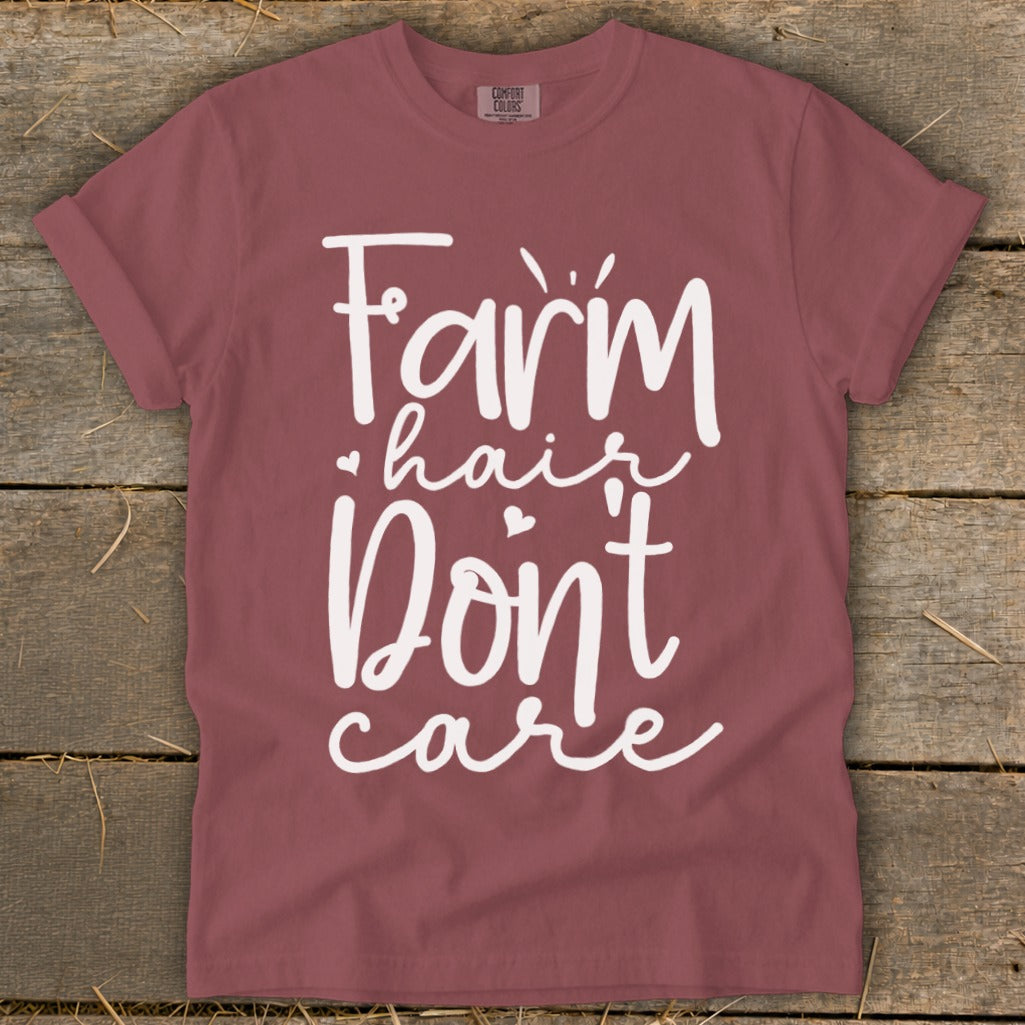 Maroon t-shirt with white text reading "Farm hair Don't care".