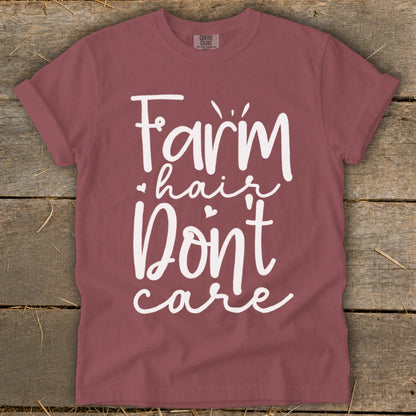 Maroon t-shirt with white text reading "Farm hair Don't care".