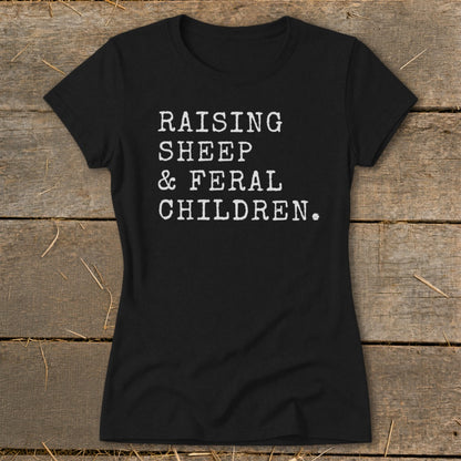 Black t-shirt with white text that reads "RAISING SHEEP & FERAL CHILDREN."