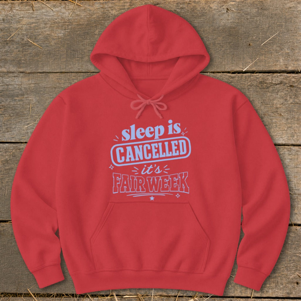 Red hoodie with "sleep is CANCELLED it's FAIR WEEK" text on chest.