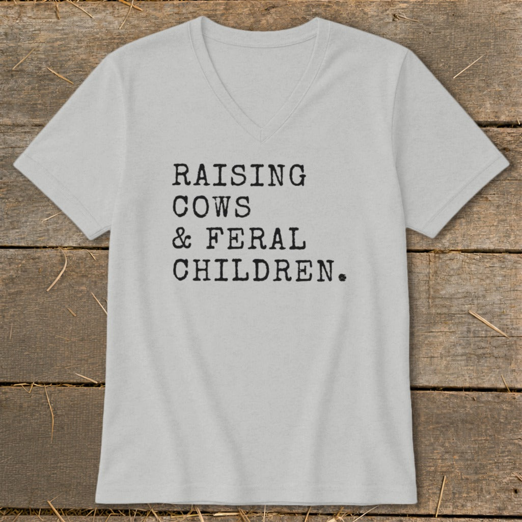 Light gray v-neck t-shirt with "Raising Cows & Feral Children." text.