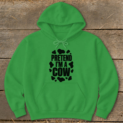 Green hoodie with black text "PRETEND I'M A COW" and cow spots.