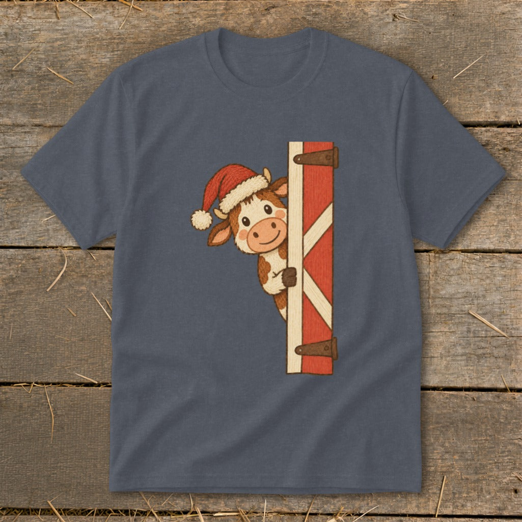 Cartoon cow wearing a Santa hat peeking around a red barn door.