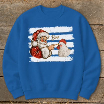 Santa booping a chicken with the word "Boop" on a blue sweatshirt.