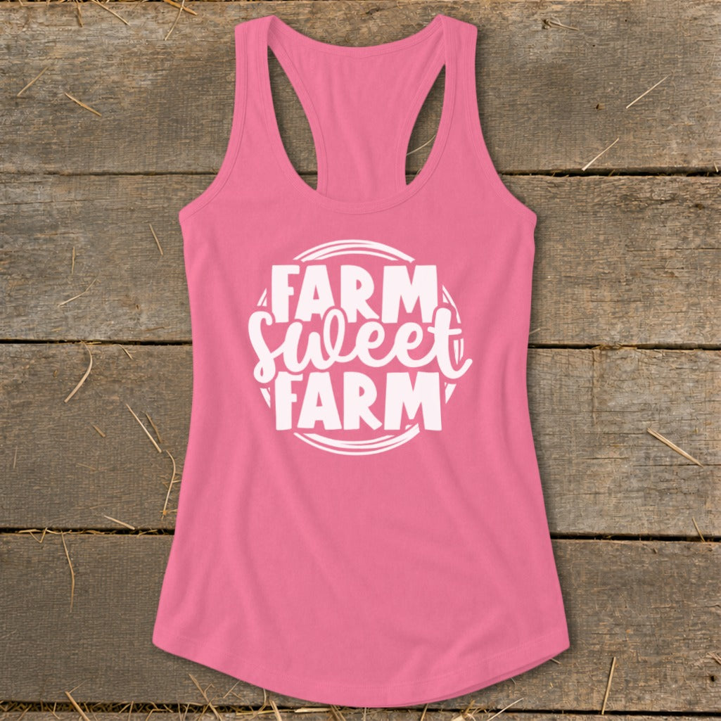 Pink racerback tank top with white "Farm Sweet Farm" text inside a circle.