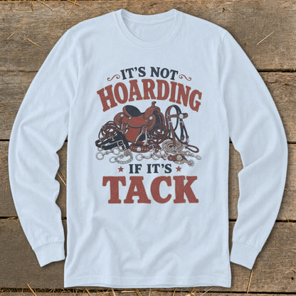 White long sleeve shirt with "It's not hoarding if it's tack" and equestrian gear graphics.