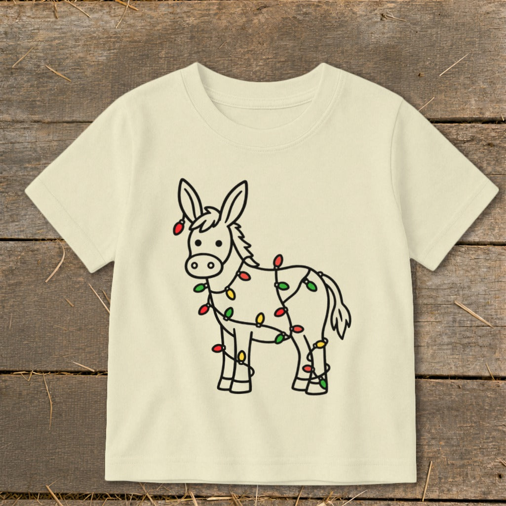 Cream t-shirt with a cartoon donkey outlined in black and decorated with Christmas lights.