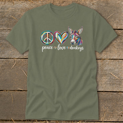 Green t-shirt with peace, heart, and donkey graphic and text peace love donkeys.