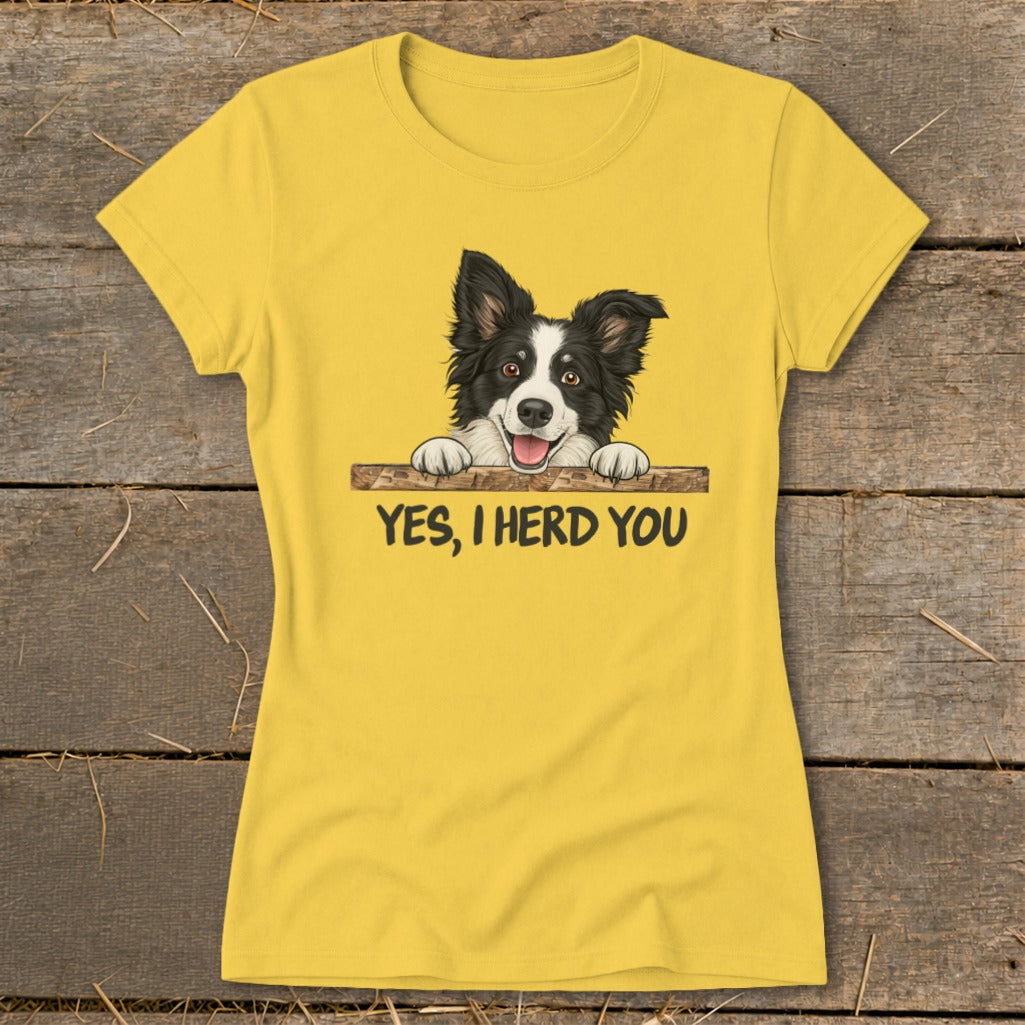 Yellow t-shirt with cartoon Border Collie peeking over a fence, saying "YES, I HERD YOU".