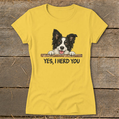Yellow t-shirt with cartoon Border Collie peeking over a fence, saying "YES, I HERD YOU".