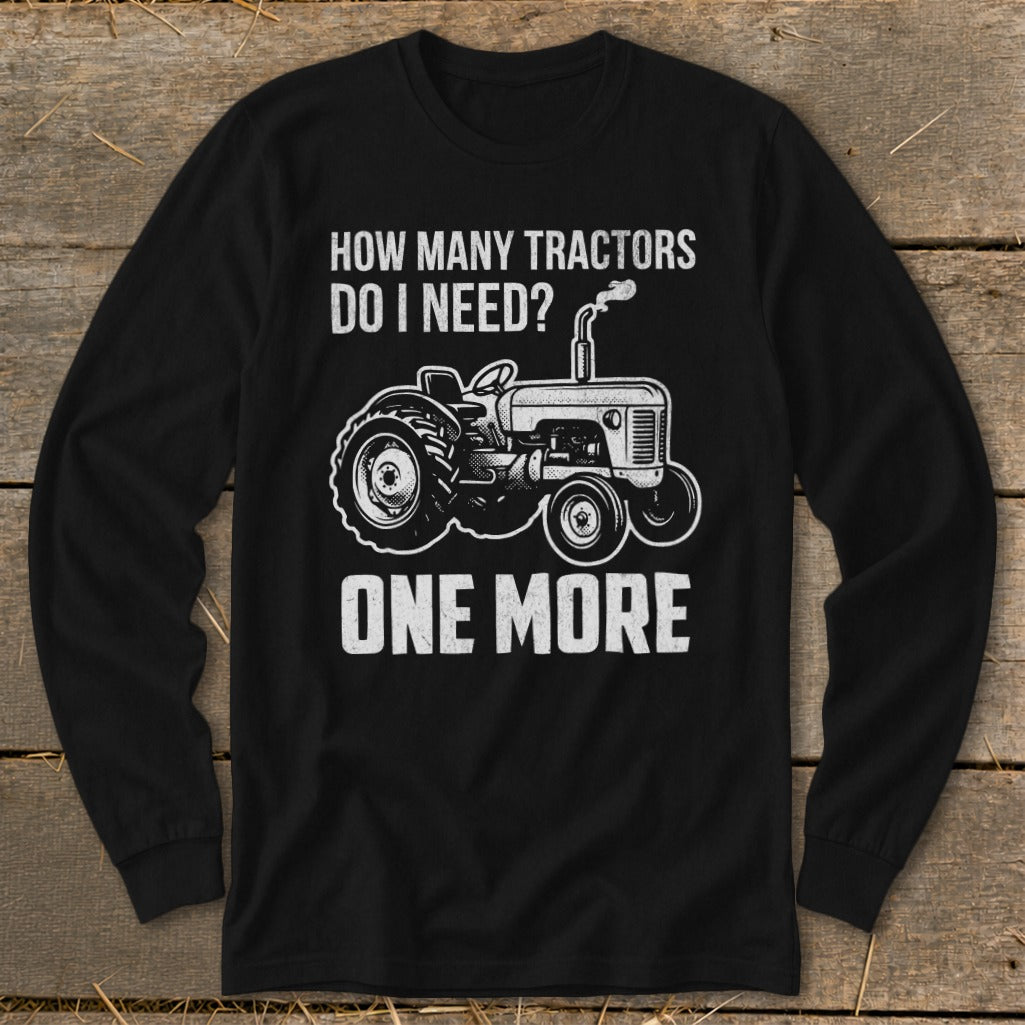 Black long-sleeve shirt with tractor graphic and text: "HOW MANY TRACTORS DO I NEED? ONE MORE"