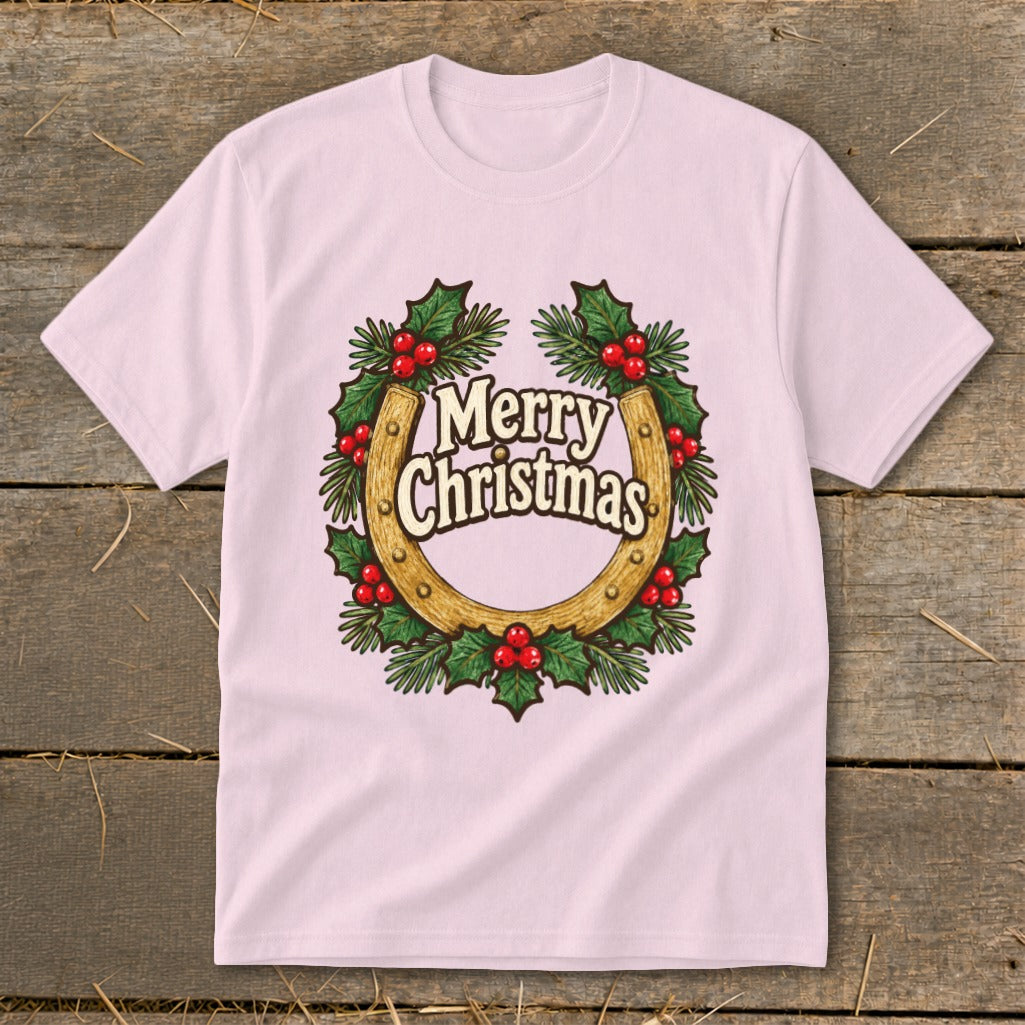 Pink t-shirt with a golden horseshoe wreath and "Merry Christmas" text.
