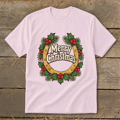 Pink t-shirt with a golden horseshoe wreath and "Merry Christmas" text.